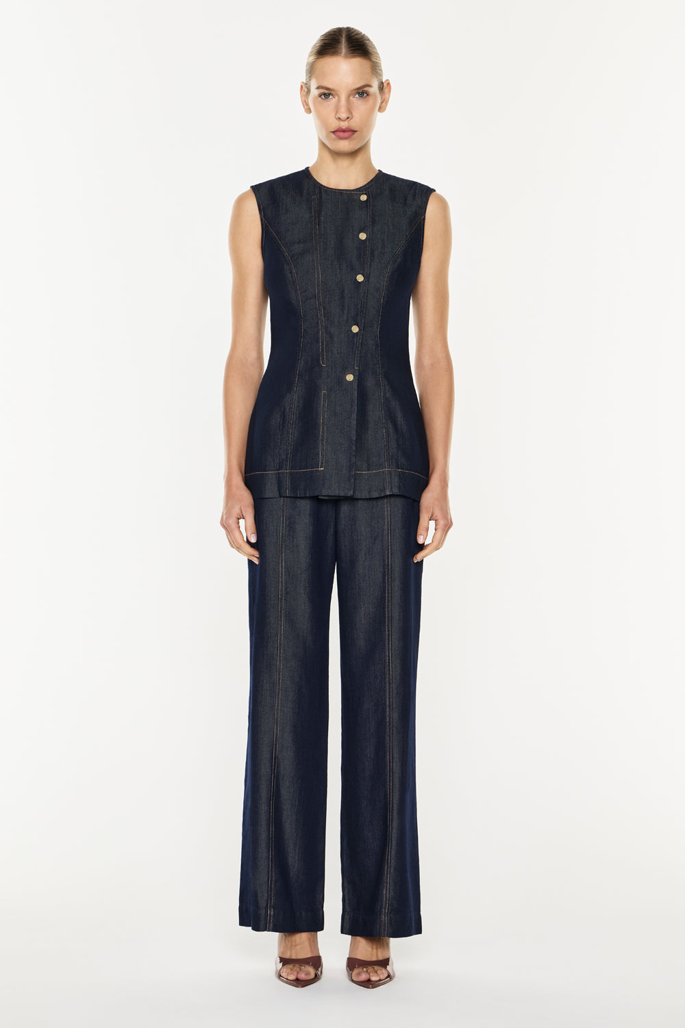 Image of a model wearing Tops. Product name - Quiet Command Gilet in Indigo colour by brand - MANNING CARTELL