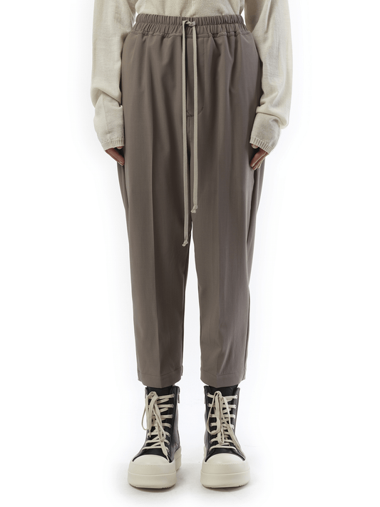 Image of a model wearing Pants. Productname: RICK OWENS Drawstring Astaires Cropped in Dust colour by brand - RICK OWENS
