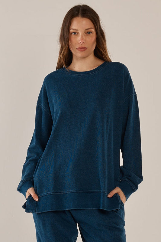 Image of a model wearing Tops. Productname: Easy Crew Sweat Indigo Wash in Indigo Wash colour by brand - Betty Basics