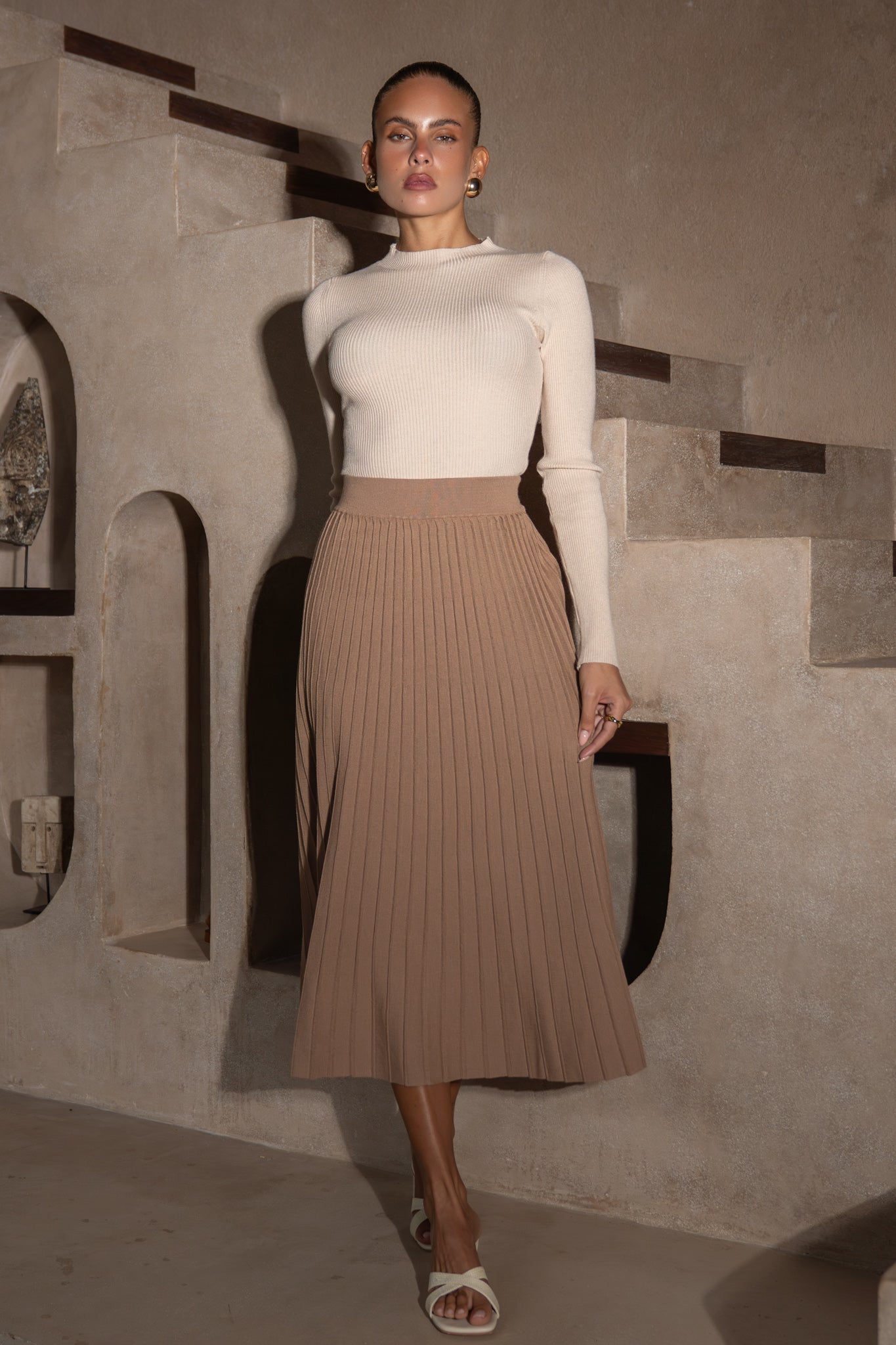 Image of a model wearing Pants. Productname: Heychic Hana Pleated Knit Midi Skirt in Brown colour by brand - Heychic