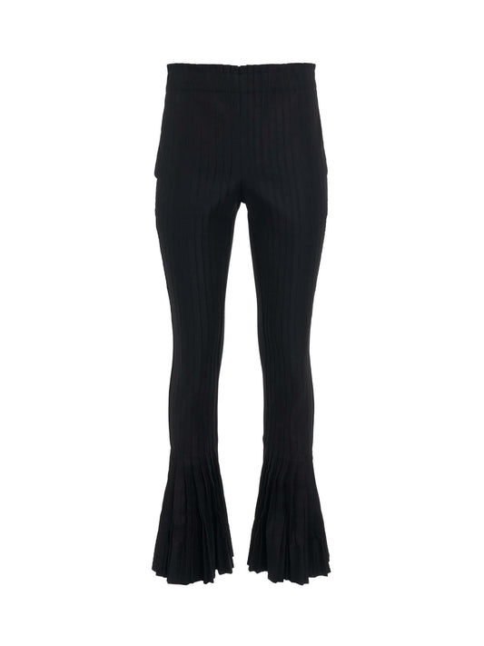 Image of a model wearing Pants. Productname: SACAI Cotton Gabardine Pleated Pants in Black colour by brand - SACAI