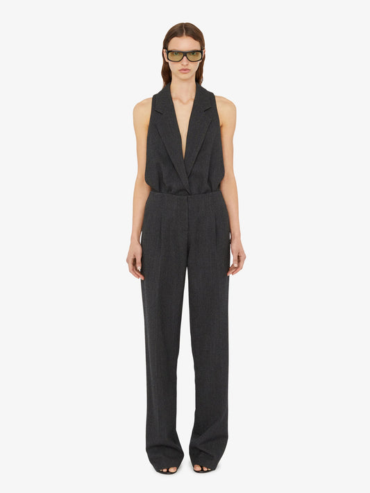 Image of a model wearing Tops. Product name - Facile Tailored Twill Bodysuit in Black colour by brand - Christopher Esber