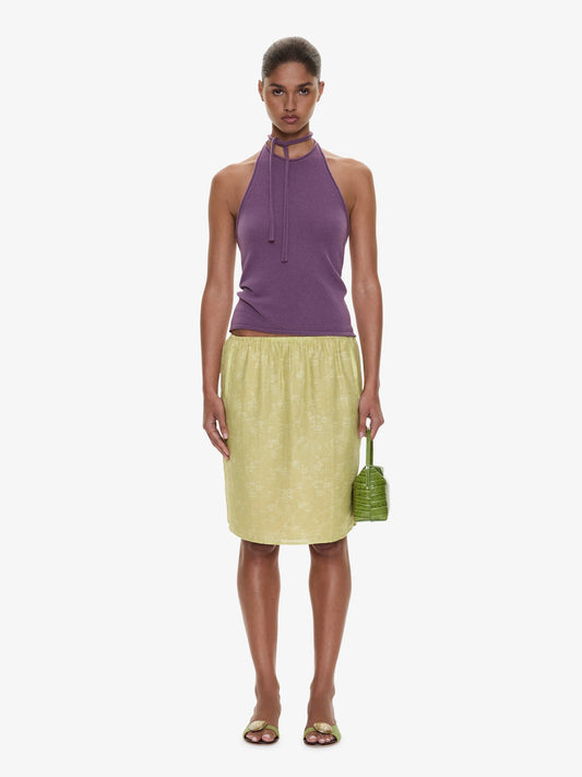 Image of a model wearing Skirts. Product name - Light Leak Jacquard Slip Skirt in Chartreuse colour by brand - CHRISTOPHER ESBER