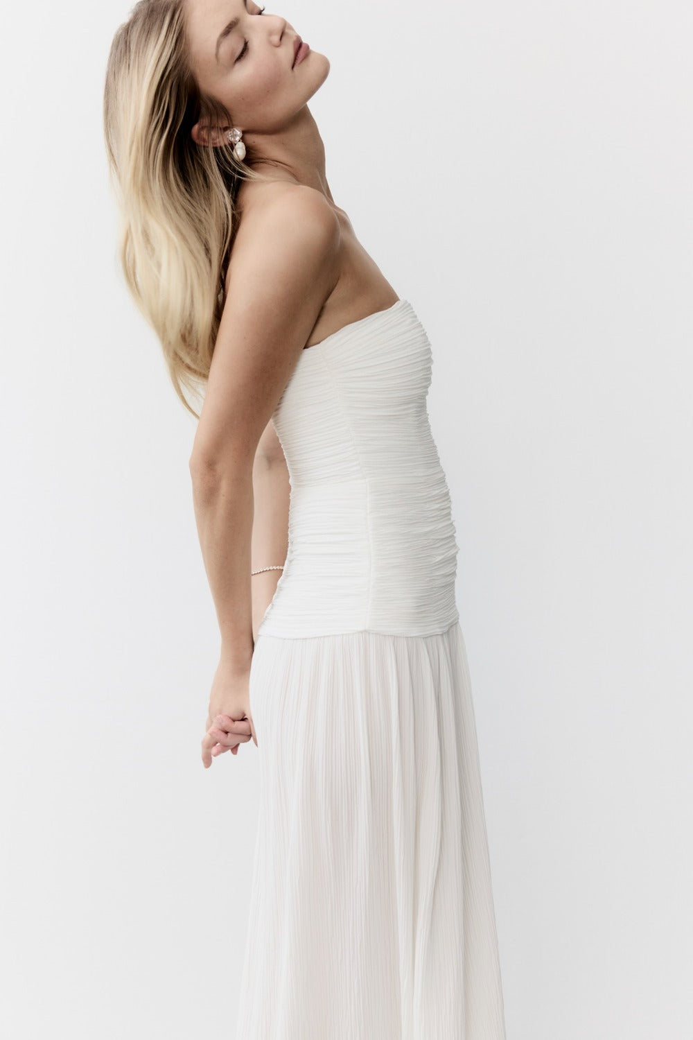 Image of Dresses. Product name - Double Time Pleat Strapless Dress in White colour by brand - MANNING CARTELL