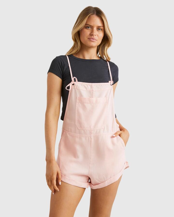 Image of a model wearing Pants. Productname: Billabong - Womens Wild Pursuit Overalls - Dusty Peach - in Dusty Peach colour by brand - Billabong