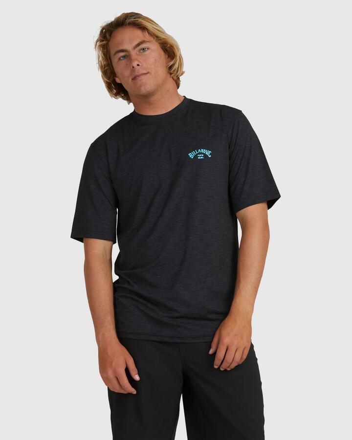 Image of a model wearing Tops. Product name - Billabong Mens Shoreline Loose Fit Short Sleeve Rash Vest Black Heather in Black Heather colour by brand - Billabong