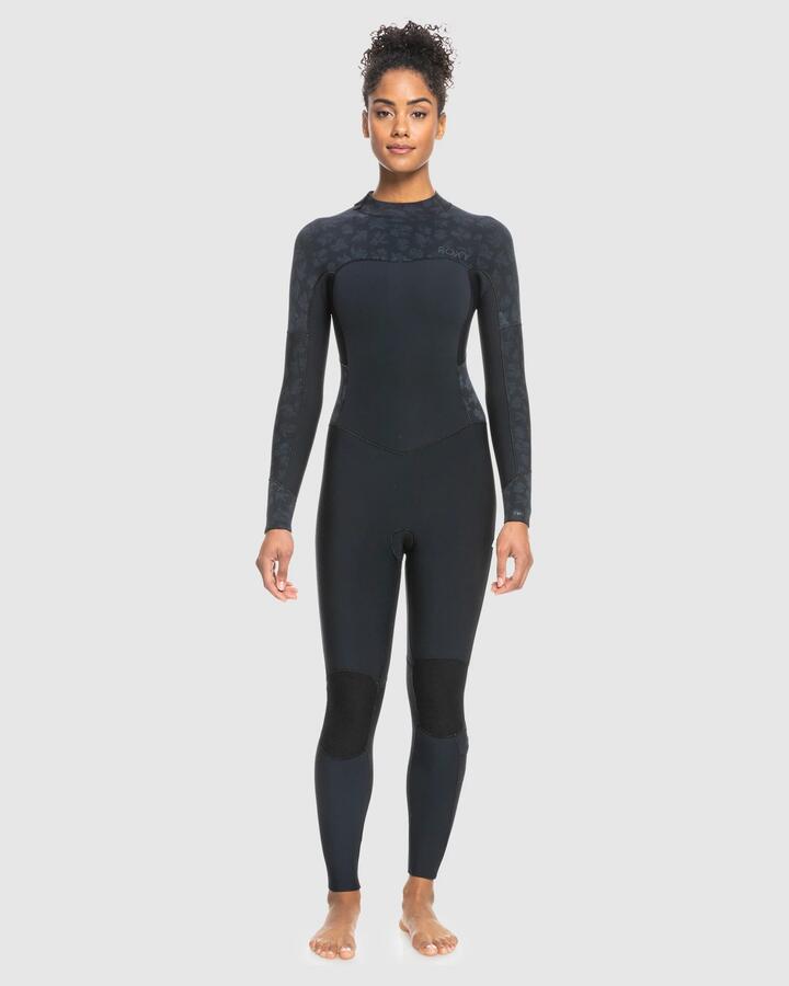 Image of a model wearing Tops. Product name - Roxy Womens 4/3Mm Swell Series Gbs Back Zip Wetsuit Black in Black colour by brand - Roxy