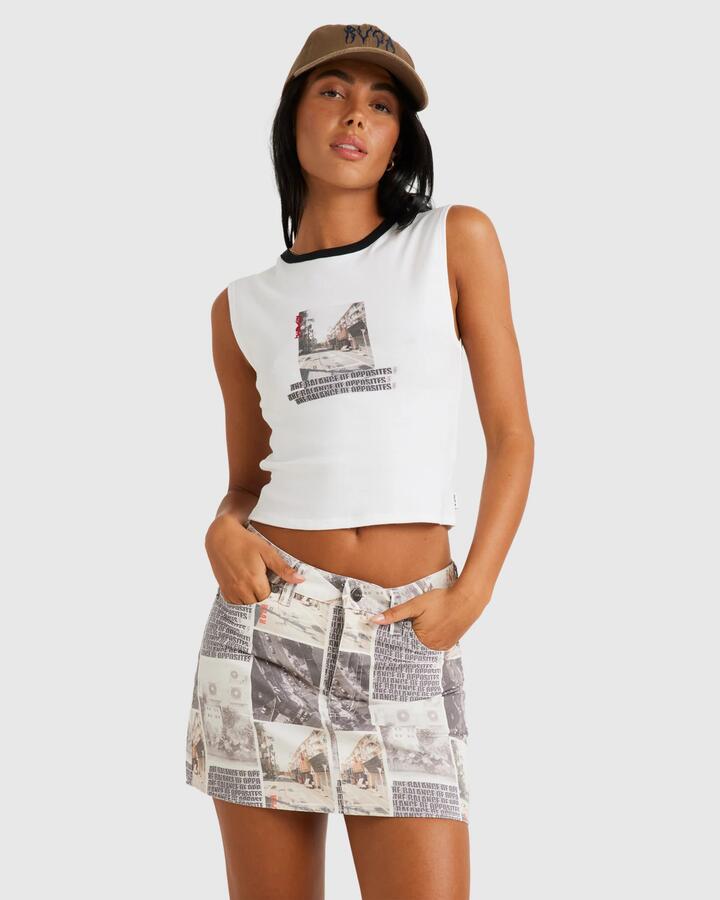 Image of a model wearing Skirts. Productname: RVCA - Womens Kyoto Mid Rise Mini Skirt - Whisper White - in Whisper White colour by brand - RVCA