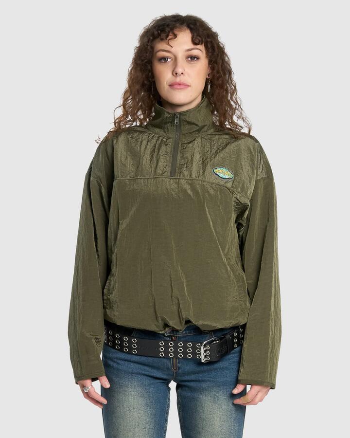 Image of a model wearing Outerwear. Productname: Worship Womens Stained Quarter Zip Nylon Jacket Stone Grey - in Stone Grey colour by brand - Worship