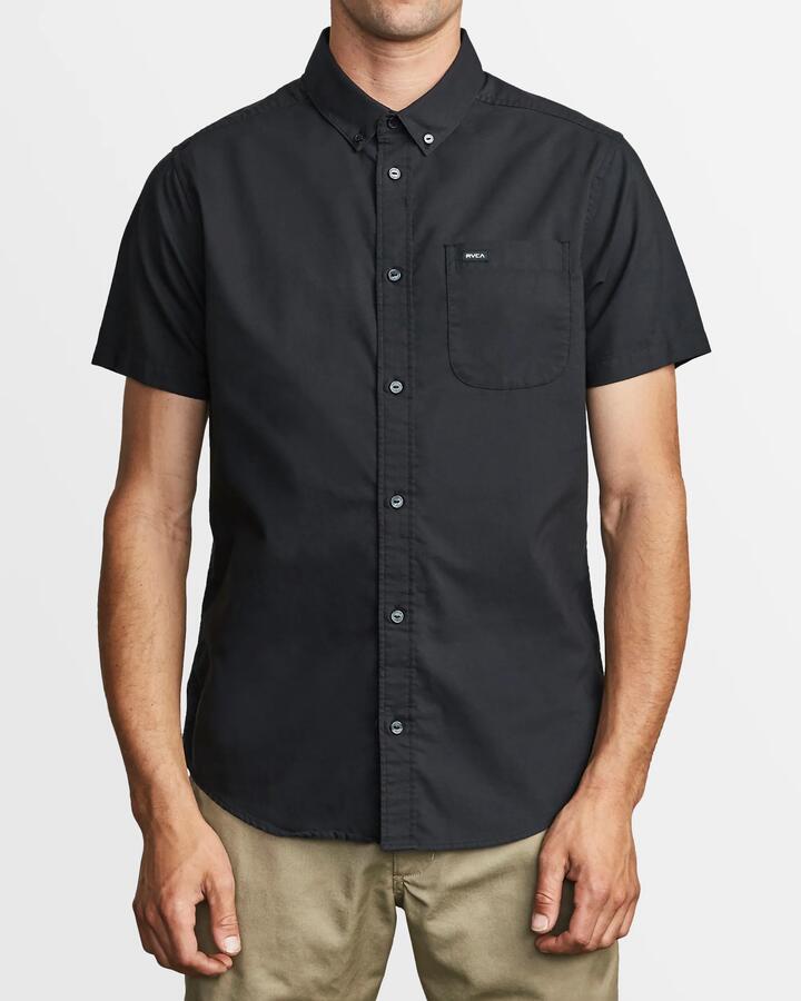 Image of a model wearing Tops. Product name - RVCA Mens Thatll Do Stretch Short Sleeve Shirt Black in Black colour by brand - RVCA