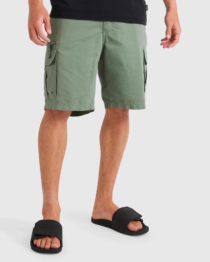 Image of a model wearing Shorts. Product name - Quiksilver Mens Maldive Atoll Cargo Shorts Seaweed in Seaweed colour by brand - Quiksilver