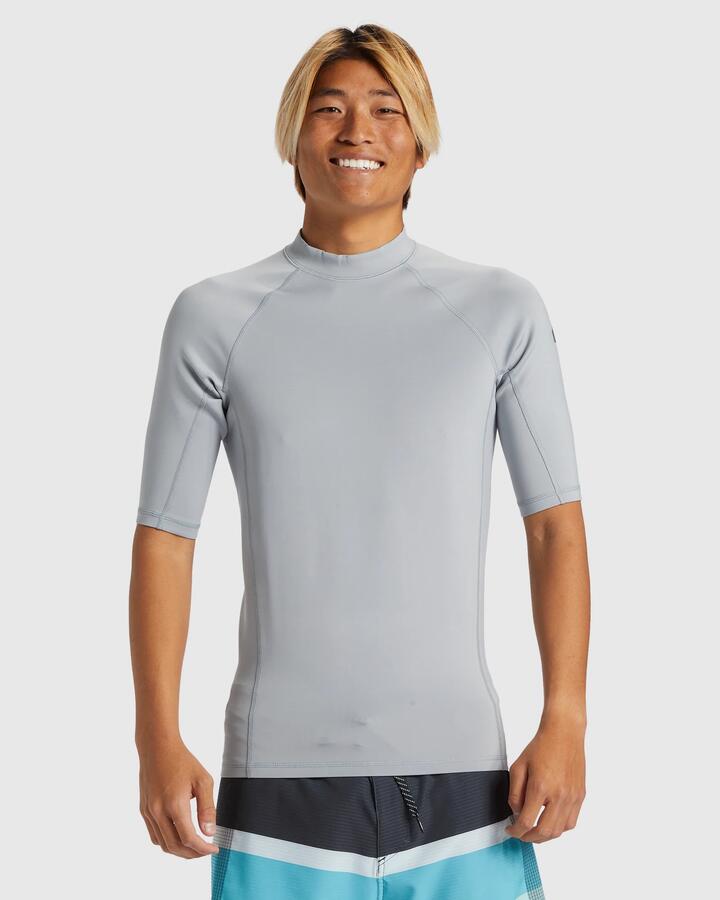 Image of a model wearing Tops. Productname: Quiksilver Mens Everyday Heat Short Sleeve Upf 50 Rash Vest Quarry - in Quarry colour by brand - Quiksilver