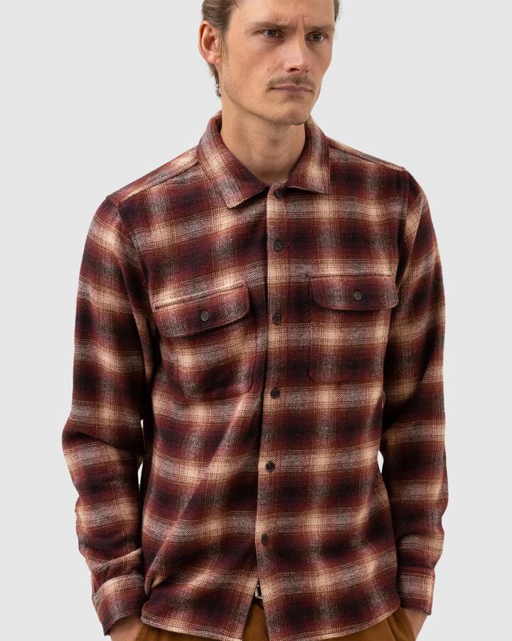 Image of a model wearing Tops. Product name - Rhythm Mens Check Long Sleeve Shirt Mulberry in Mulberry colour by brand - Rhythm