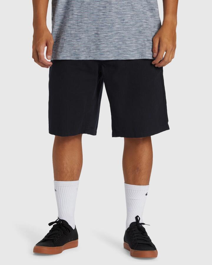 Image of a model wearing Shorts. Product name - Quiksilver Mens Carpenter Walkshorts Black in Black colour by brand - Quiksilver