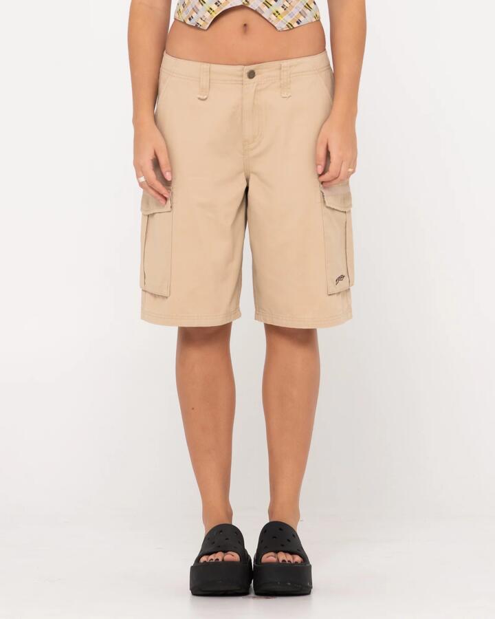 Image of a model wearing Shorts. Product name - Rusty Womens Tank Girl Low Rise Loose Fit Cargo Shorts Oatmilk in Oatmilk colour by brand - Rusty