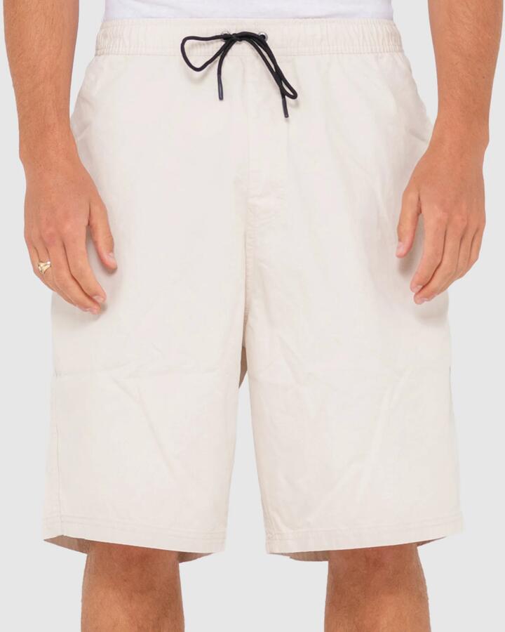 Image of a model wearing Shorts. Productname: Rusty - Mens Wear Eva Elastic Shorts - Oatmeal - in Oatmeal colour by brand - Rusty
