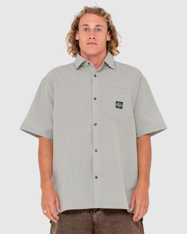 Image of a model wearing Tops. Productname: Rusty - Mens R2K Drop Hem Short Sleeve Shirt - Oyster Grey - in Oyster Grey colour by brand - Rusty