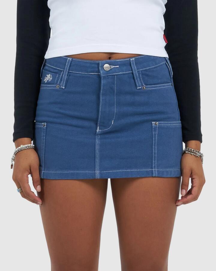 Image of a model wearing Skirts. Productname: Worship - Womens Patches Rivet Mini Skirt - Folkstone Overdye - in Folkstone Overdye colour by brand - Worship