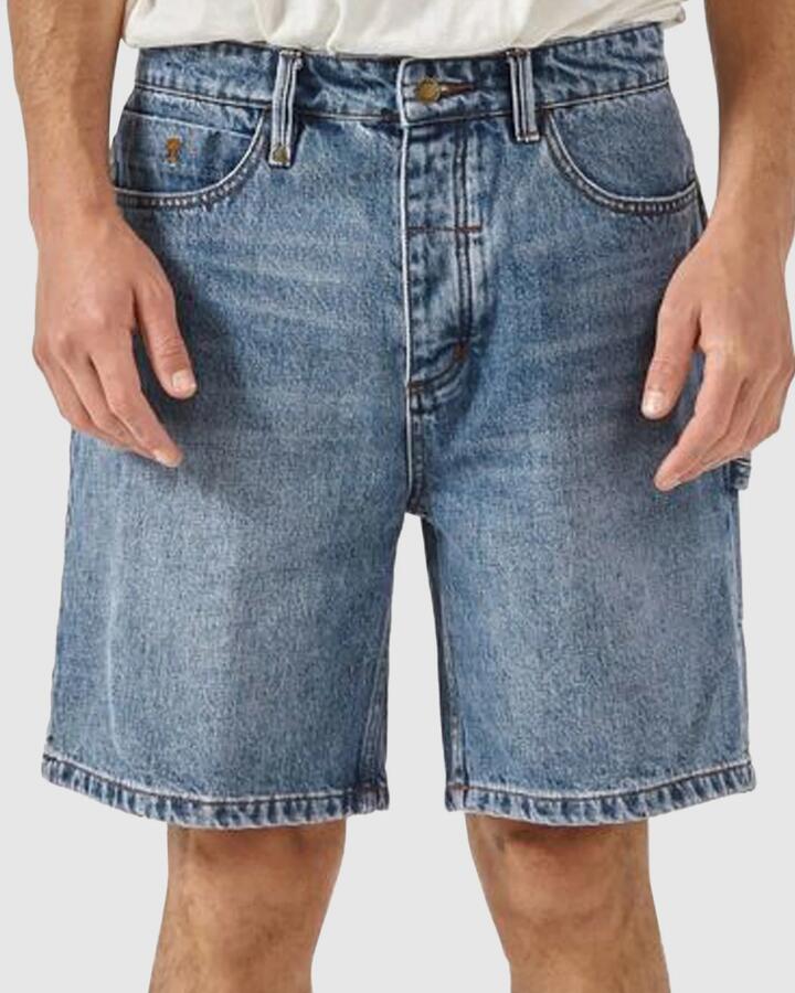 Image of a model wearing Shorts. Productname: Thrills Mens Slacker Denim Shorts Weathered Blue - in Weathered Blue colour by brand - Thrills