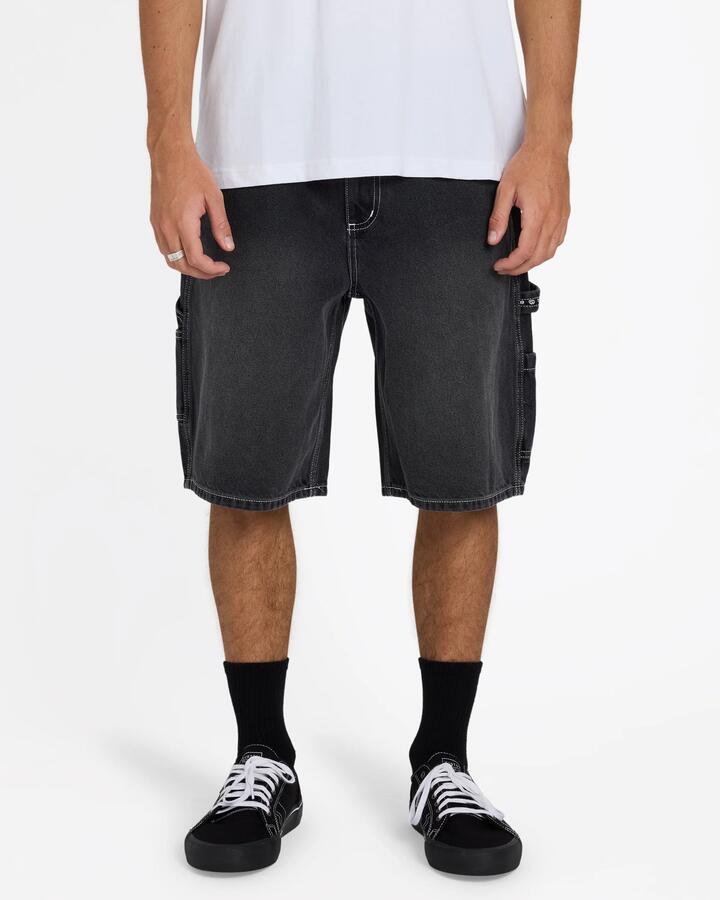 Image of a model wearing Shorts. Product name - Billabong Mens Bad Dog Denim 22" Shorts Washed Black in Washed Black colour by brand - Billabong