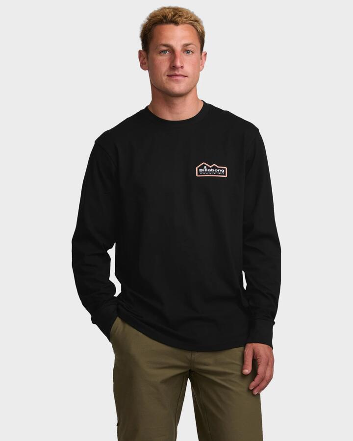 Image of a model wearing Tops. Productname: Billabong - Mens Range A/Div Long Sleeve T-Shirt - Black - in Black colour by brand - Billabong