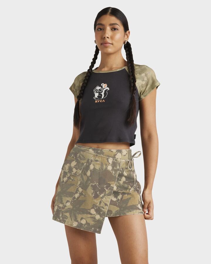 Image of a model wearing Skirts. Productname: RVCA Womens Wrapped Cargo Mini Skirt Camo - in Camo colour by brand - RVCA