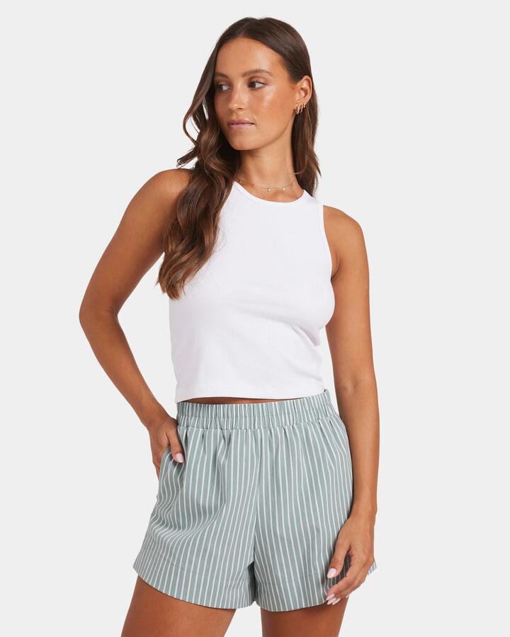 Image of a model wearing Tops. Product name - Nunui Womens Boyfriend Rib Tank White in White colour by brand - Nunui