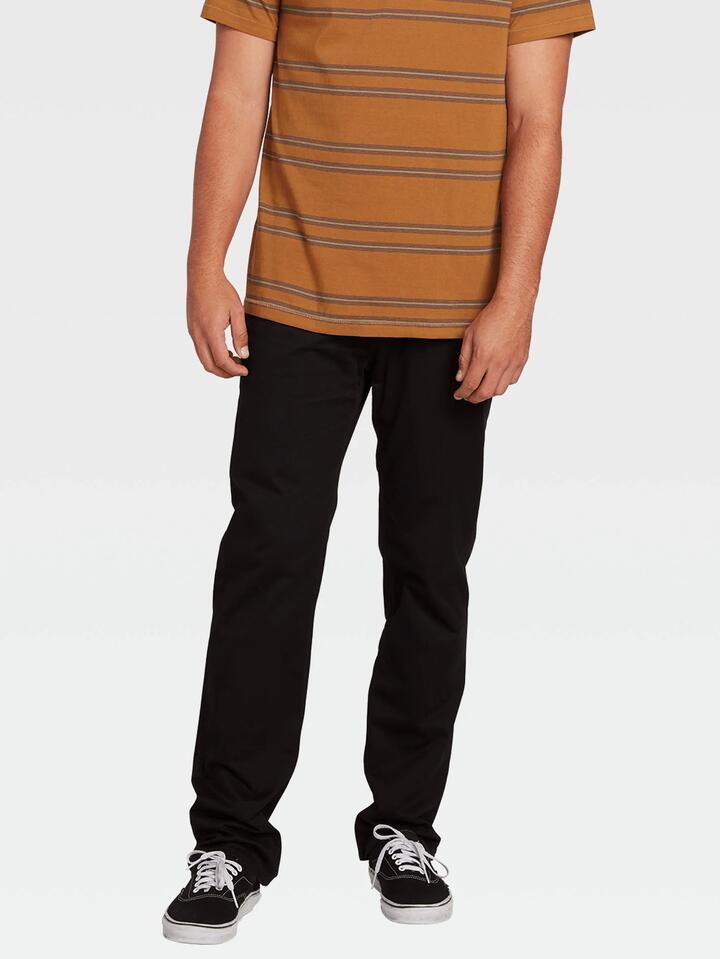 Image of a model wearing Pants. Product name - Volcom Mens Solver Lite 5 Pocket Chino Pants Black in Black colour by brand - Volcom