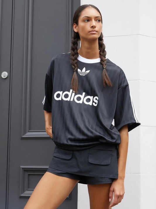 Image of a model wearing Skirts. Productname: Lioness Countryside Skort in Onyx Stripe colour by brand - Lioness