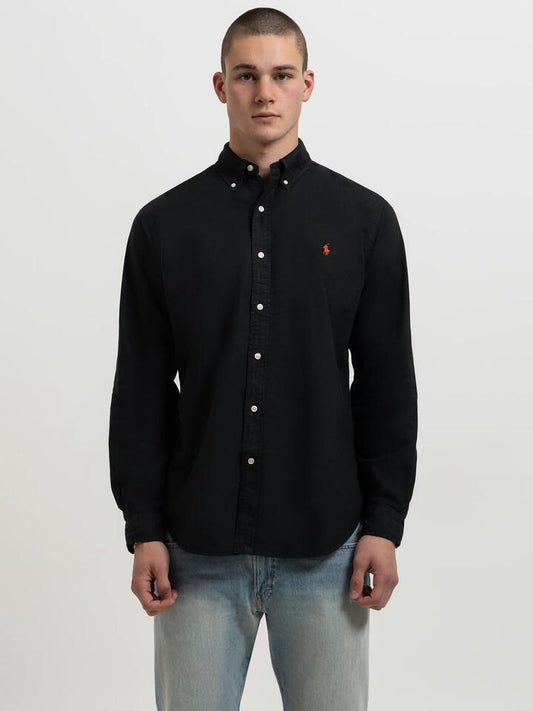 Image of a model wearing Tops. Productname: Polo Ralph Lauren Long Sleeve Embroidered Shirt in Black colour by brand - Polo Ralph Lauren