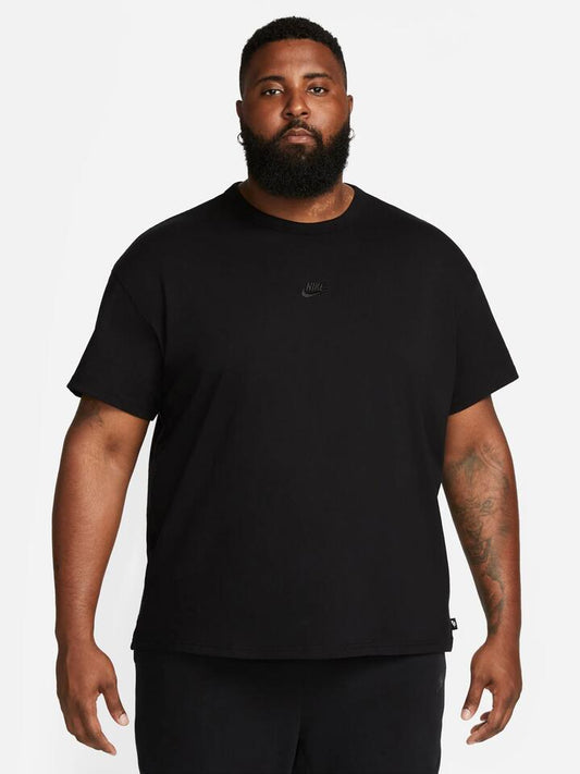 Image of a model wearing Tops. Productname: Nike Sportswear Premium Essentials T-Shirt in Black colour by brand - Nike