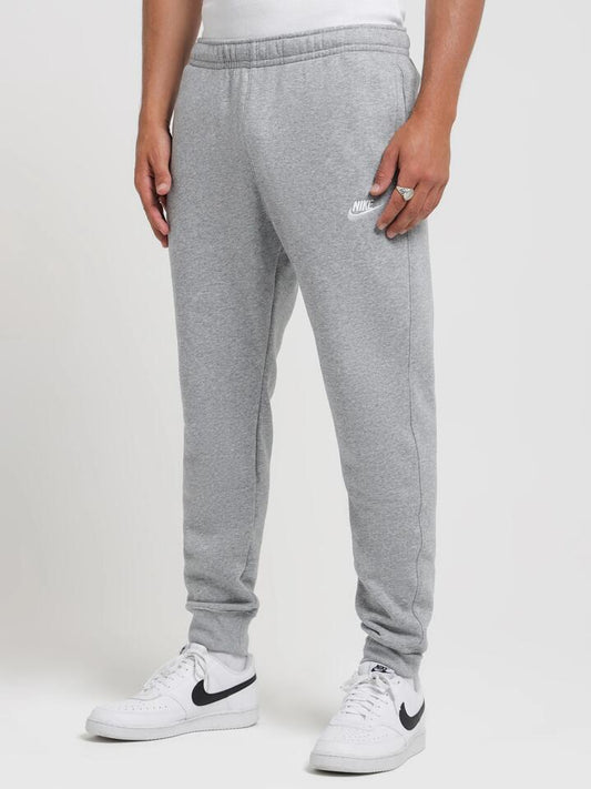 Image of a model wearing Outerwear. Productname: Nike Sportswear Club Fleece Joggers in Dark Grey colour by brand - Nike