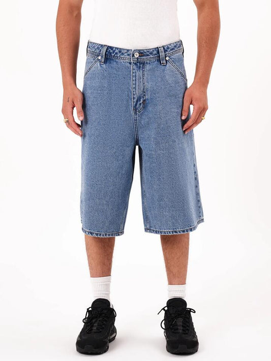 Image of a model wearing Shorts. Productname: Abrand A6 Big Baggy Short Davis Jorts in Mid Vintage Indigo colour by brand - Abrand