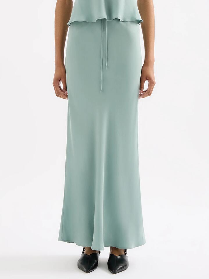 Image of a model wearing Skirts. Productname: Nude Lucy Lea Cupro Skirt in Capri colour by brand - Nude Lucy