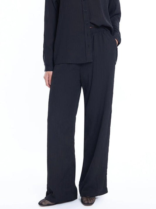 Image of a model wearing Pants. Productname: Lulu & Rose Maddy Pant in Black colour by brand - Lulu & Rose