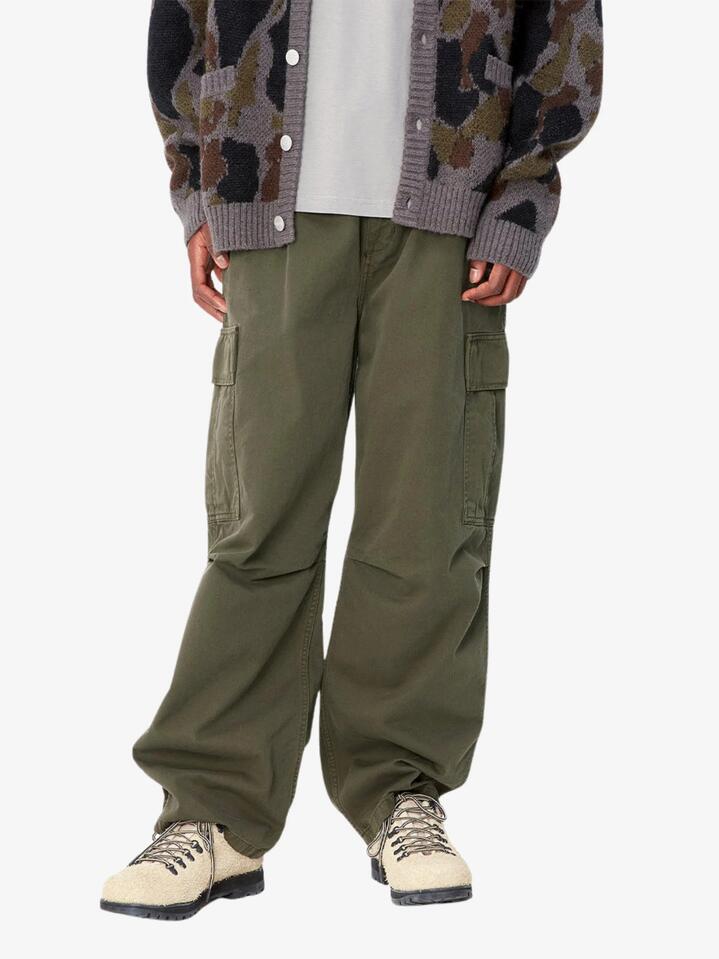 Image of a model wearing Pants. Productname: Carhartt Wip Cole Cargo Pant in Office Green colour by brand - Carhartt Wip