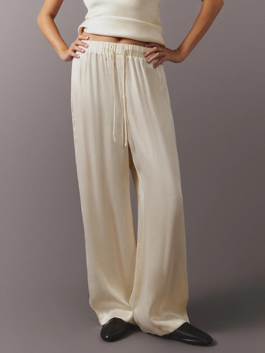 Image of a model wearing Pants. Productname: MSE Cupro Drawstring Pant in Marshmallow colour by brand - MSE