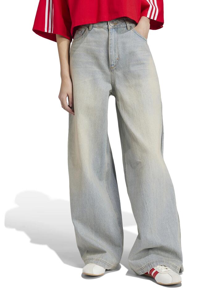 Image of a model wearing Denim. Productname: Adidas Denim Zip Pant in LIGHT DENIM colour by brand - Adidas