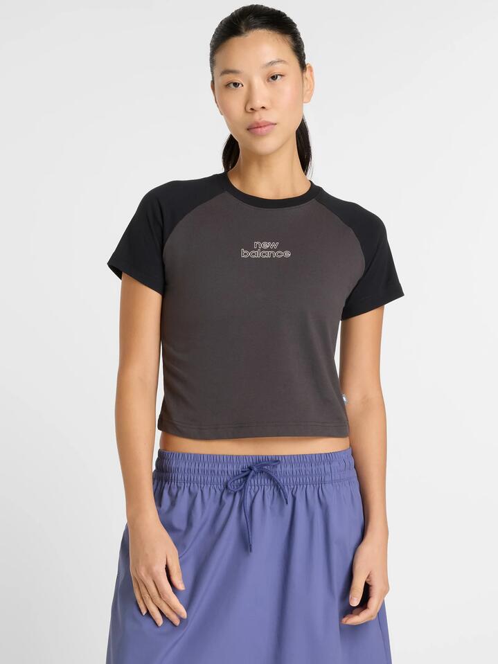 Image of a model wearing Tops. Productname: New Balance Graphic Slim T-Shirt in Black colour by brand - New Balance
