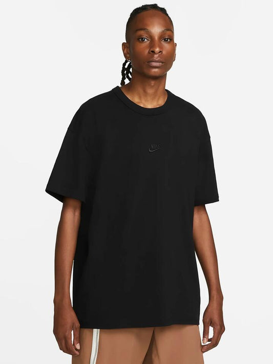 Image of a model wearing Tops. Productname: Nike Premium Essentials T-Shirt in Parachute Beige colour by brand - Nike