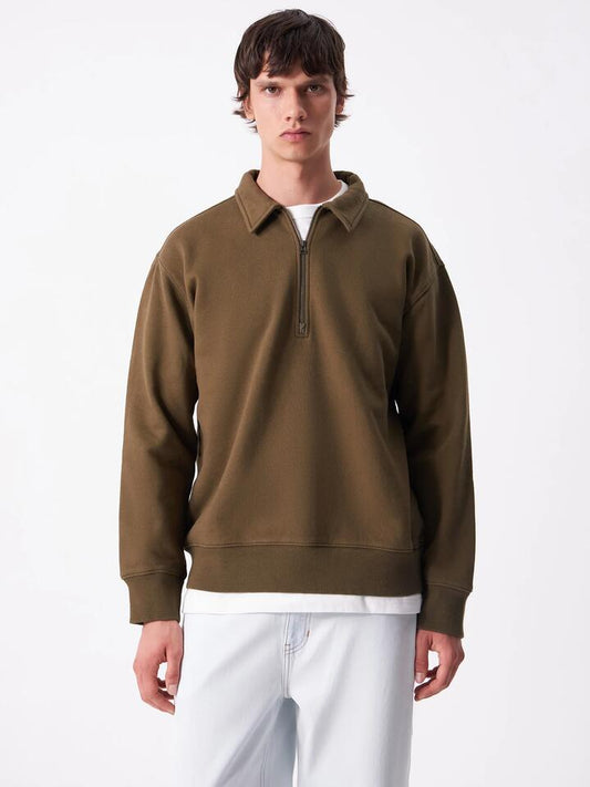 Image of a model wearing Outerwear. Productname: Article One Article Collared Zip Sweat in Deep Olive colour by brand - Article One