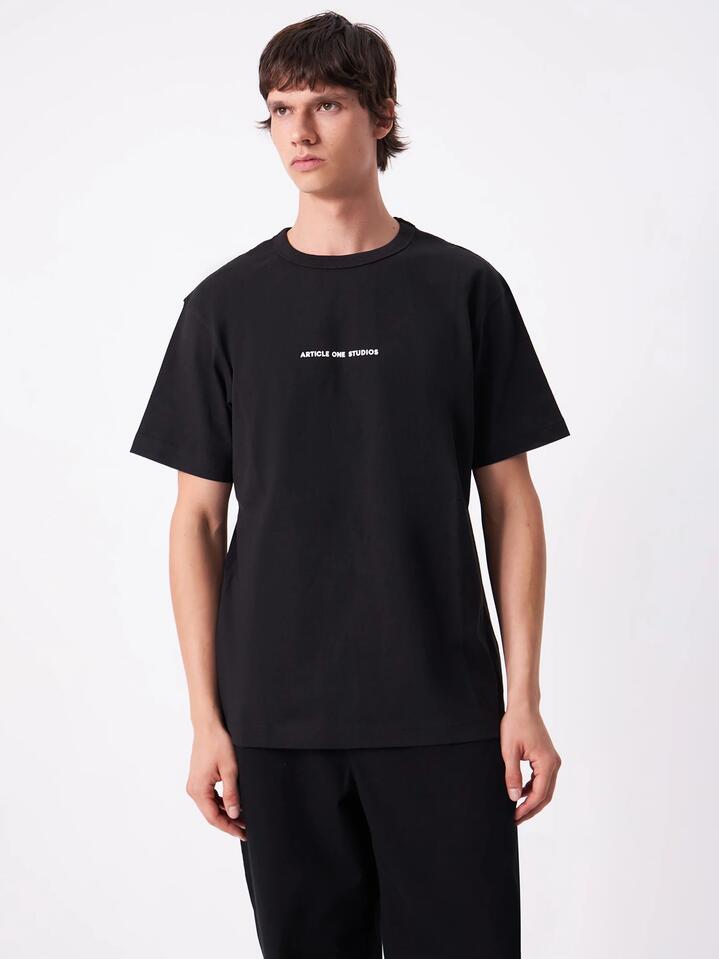 Image of a model wearing Tops. Productname: Article One Everyday Logo Tee in Black colour by brand - Article One