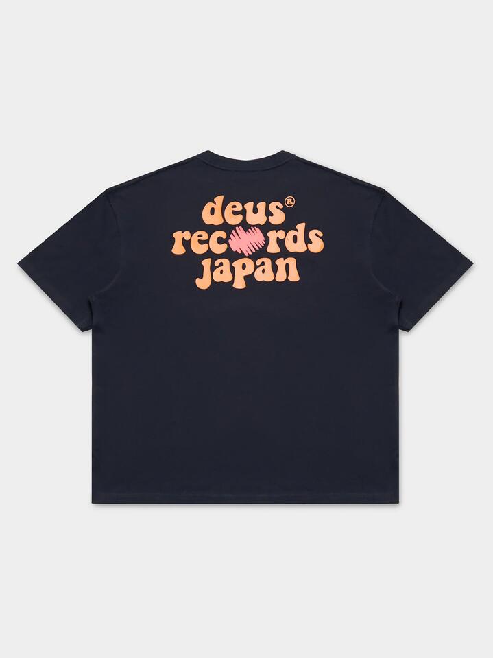 Image of a model wearing Tops. Productname: Deus Thumper Tee in Black colour by brand - Deus
