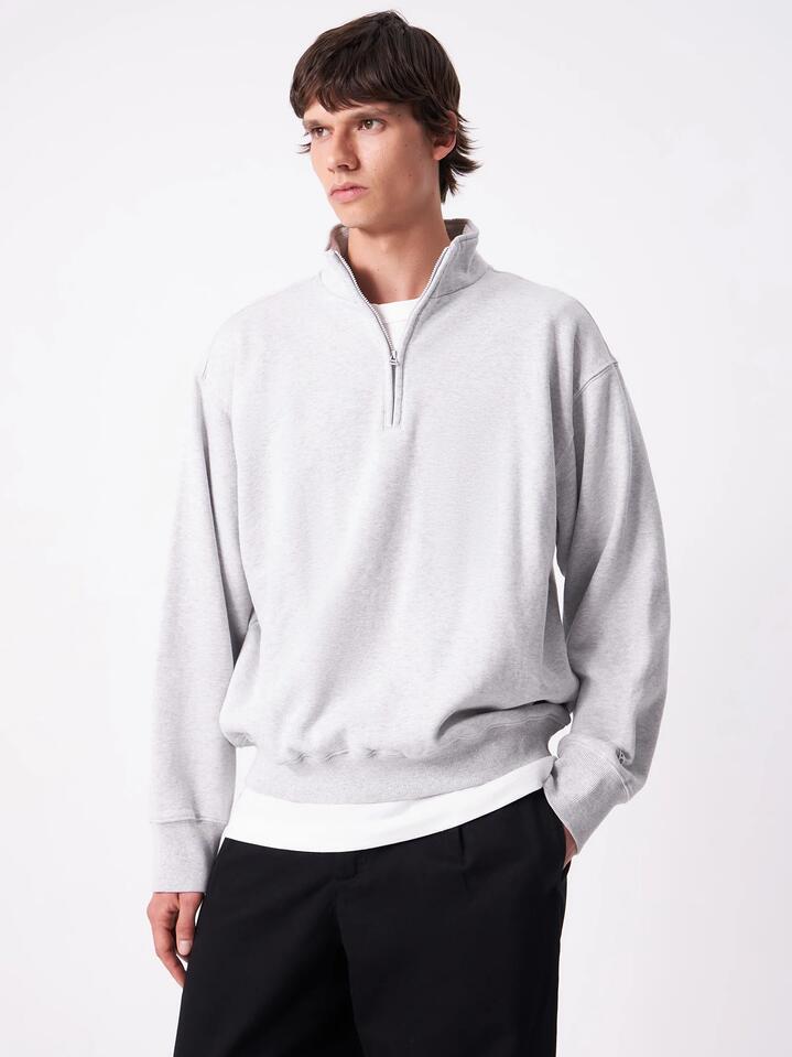 Image of a model wearing Outerwear. Productname: Article One Article Rose 1/4 Zip in Ash Marle colour by brand - Article One