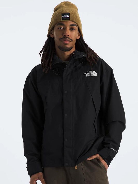 Image of a model wearing Outerwear. Productname: The North Face Men's DryVent Mono Mountain Jacket in Tnf Black colour by brand - The North Face