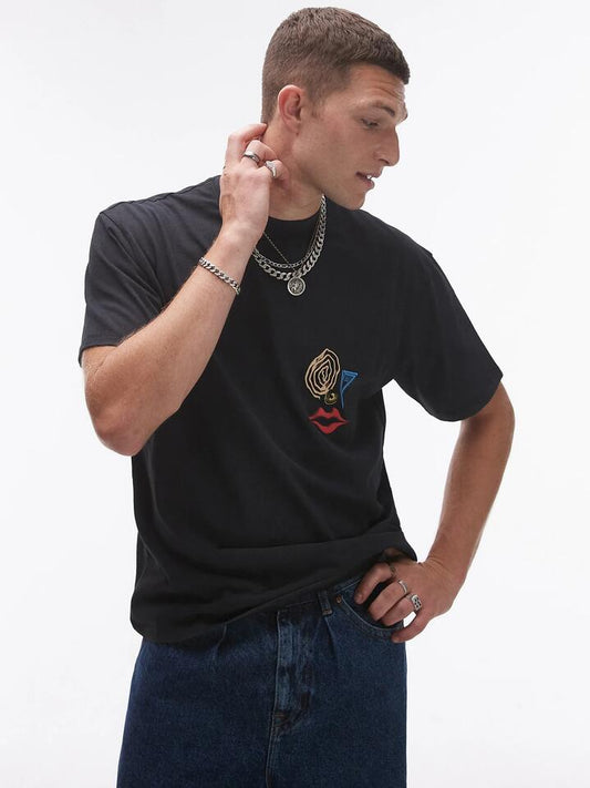 Image of a model wearing Tops. Productname: Topman Abstract Face Print Oversized T-Shirt in Washed Black colour by brand - Topman