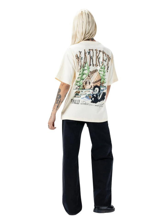 Image of a model wearing Tops. Productname: Market Smiley Quiet Cabin T-Shirt in Buttercream colour by brand - Market