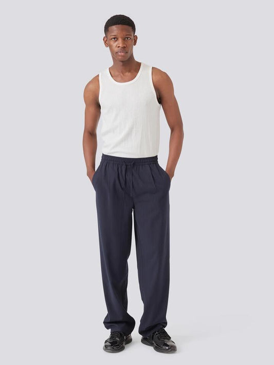 Image of a model wearing Pants. Productname: Barney Cools Boxy Suit Pant in Slate Stripe colour by brand - Barney Cools