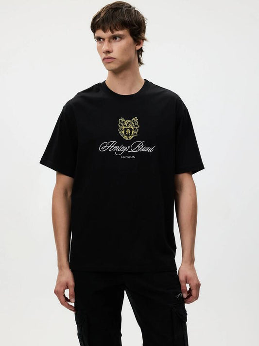 Image of a model wearing Tops. Productname: Henleys Knight Tee in Black colour by brand - Henleys