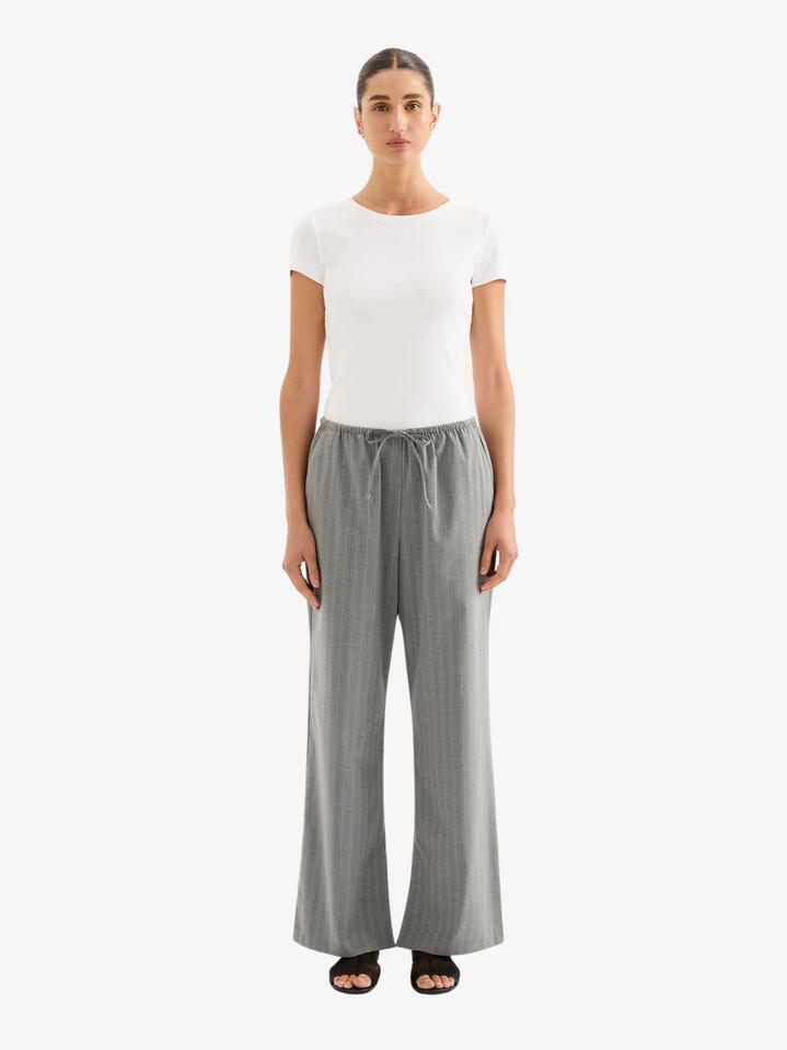 Image of a model wearing Pants. Productname: Nude Lucy Cilia Drawstring Pant in Steel Stripe colour by brand - Nude Lucy